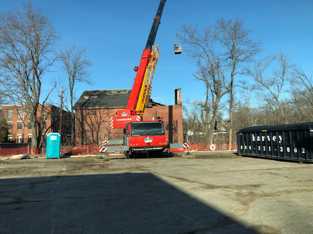 Contactor Bill Cogley dangling in the air above Two Old Elm Street