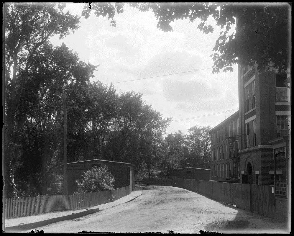 The Faulkner Manufacturing Company storehouse opposite the main mill complex which was removed when the new concrete bridge was built in 1910.