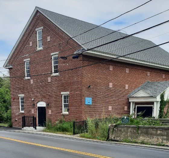 In this photo the signs are in place but the area around the building had not been cleaned-up.