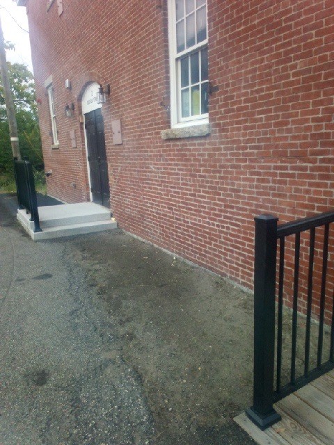 A close up of the weeds around the building in August 2026.